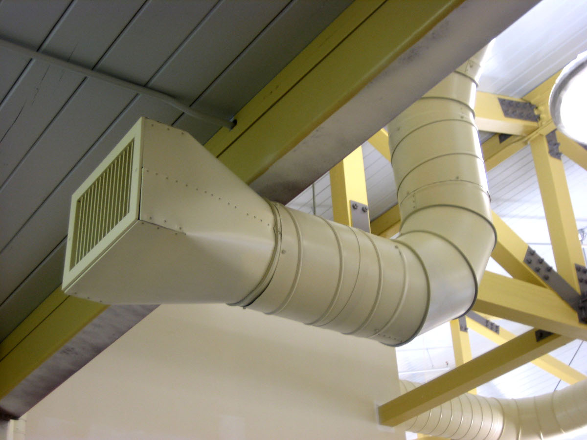 HVAC system at a library, with a pipe extending down from a ceiling. Photo by: Michael Casey. Creative Commons CC BY 2.0 DEED Attribution 2.0 Generic license: https://creativecommons.org/licenses/by/2.0/.