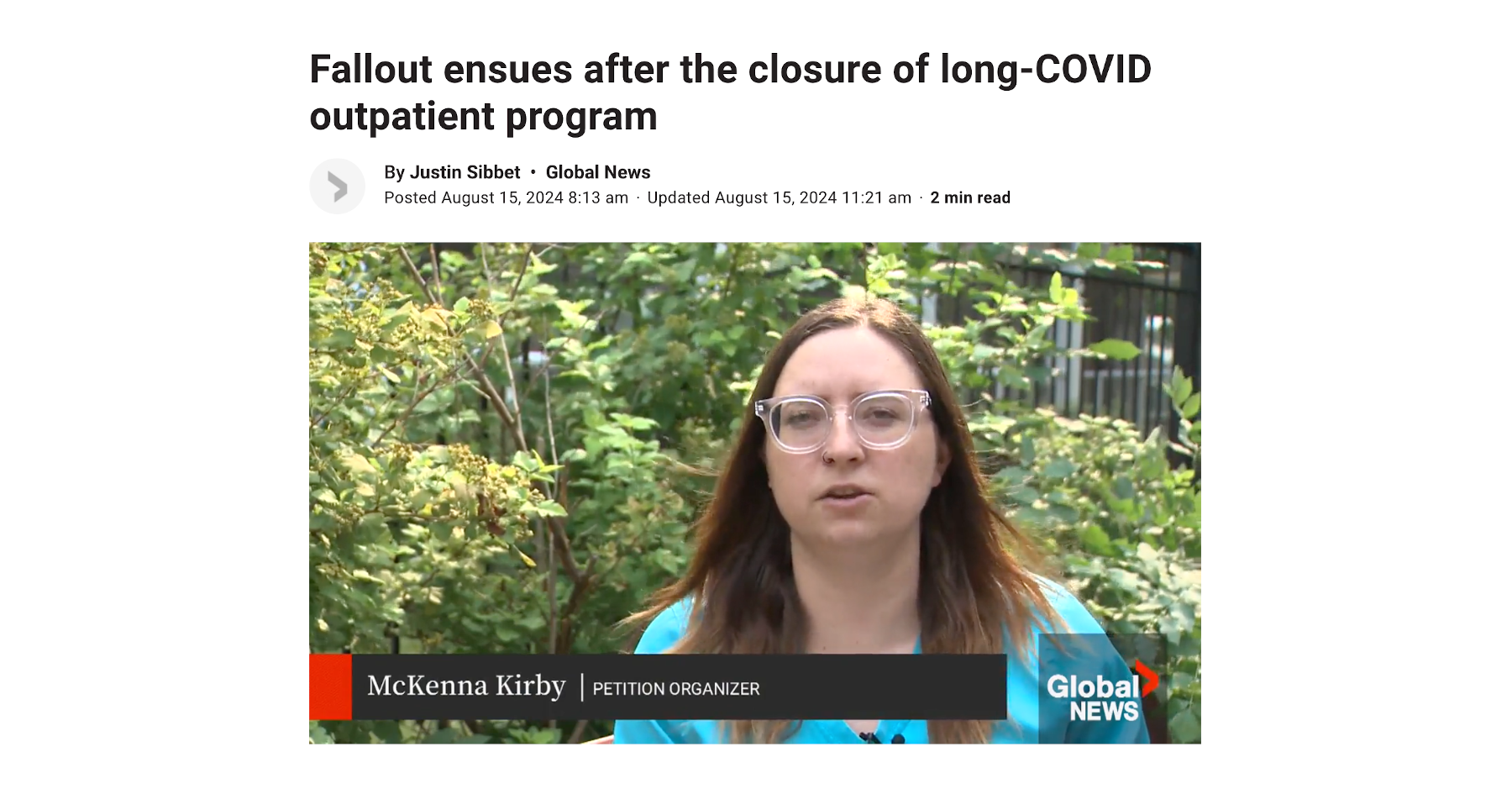 Screenshot of video from Global News. Petition organizer McKenna Kirby is speaking. She has light brown hair, glasses, and a light blue top.